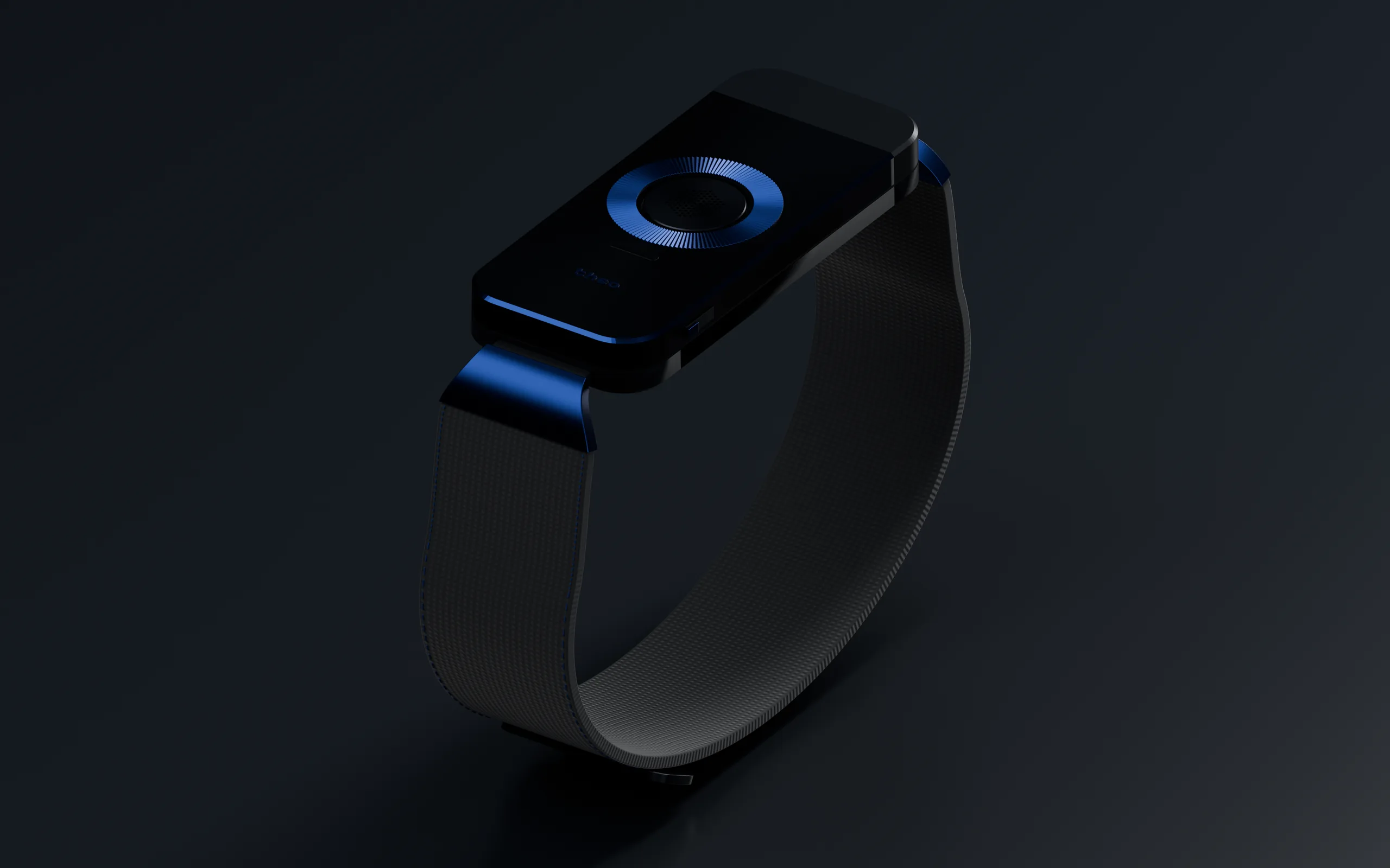 The Midnight TheoBand in a dark studio: a black slab on a black textile, its ring and chamfer catching the light.