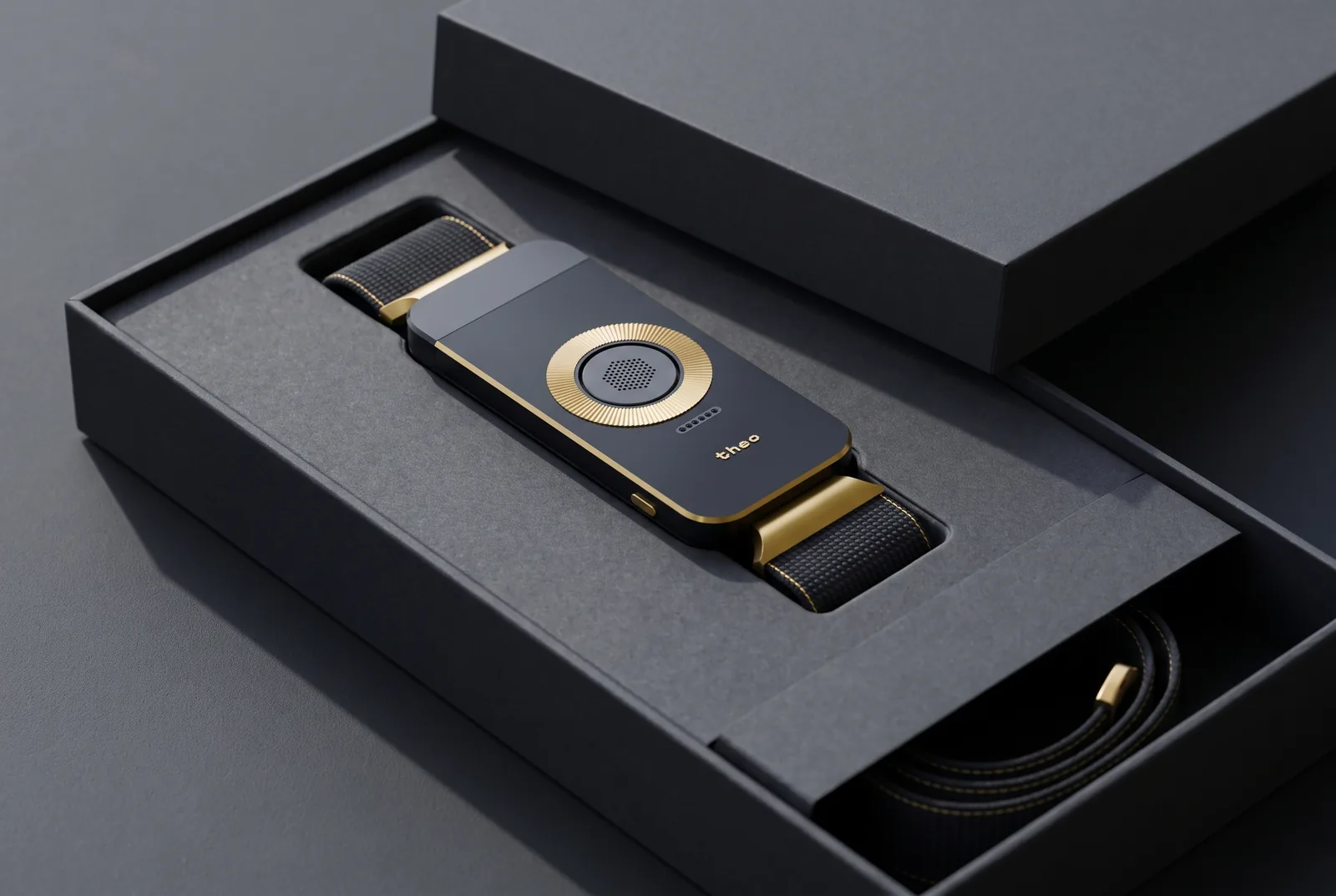 The Black / Gold band in its open box, the strap coiled beside it.