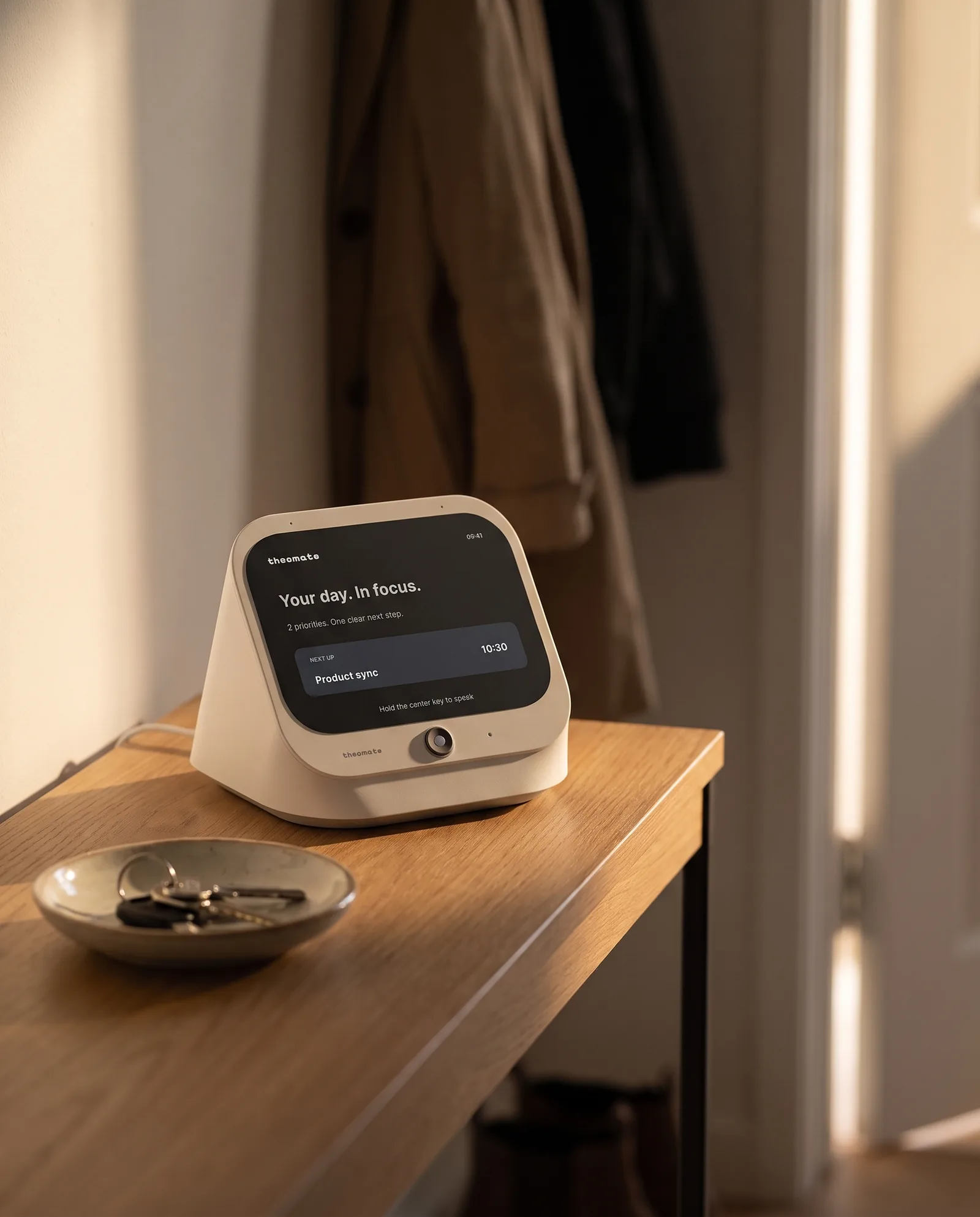 The Cloud desk set down on a hallway console beside a small tray.